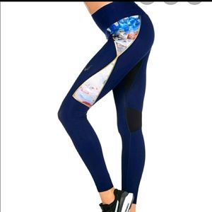 Midnight blue leggings with mesh panels. Zippered